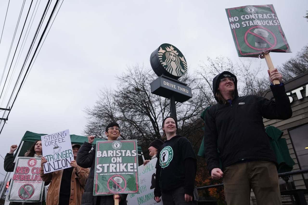 default-154 Workers protesting outside a Starbucks store.
