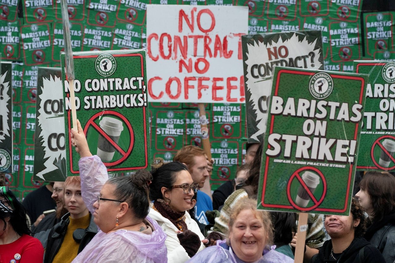 default-156 People holding picket signs.