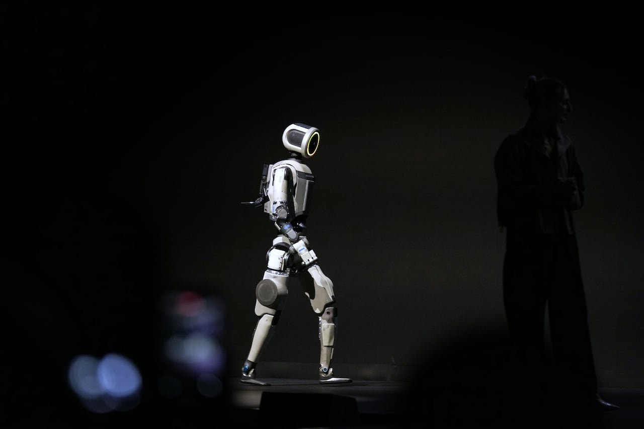 default-206 A robot walking on a stage.
